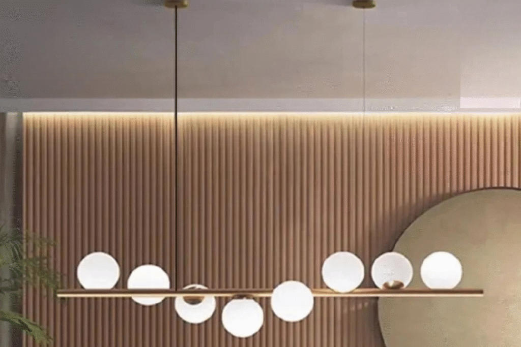 نجفة خطية مودرن بتصميم ذهبي راقٍ وكور زجاجية بيضاء تمنح إضاءة أنيقة وهادئة للمساحات العصرية. 📌 Product Description (الوصف الكامل الاحترافي) اجعل إضاءة مكانك أكثر فخامة مع هذه النجفة الخطية المودرن ذات الشاسيه الذهبي البراق والكور الزجاجية البيض